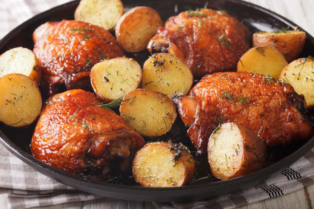 Maple chicken thighs and baby potatoes close-up