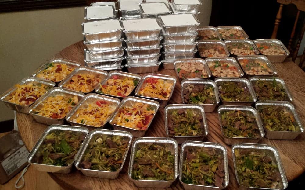 individually packaged meals ready to be frozen, some with paper lids on