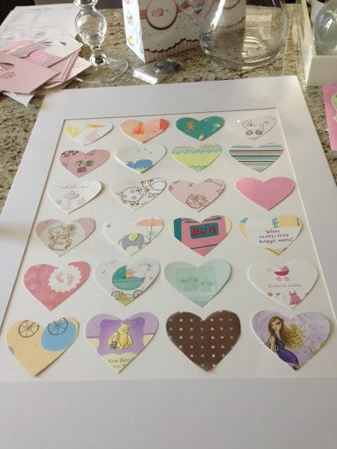 framed paper hearts cut from baby cards
