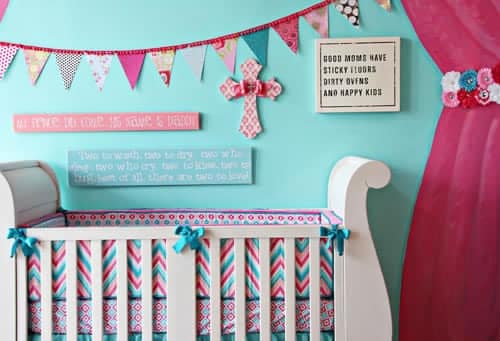 very colorful baby nursery in shades of teal and hot pink