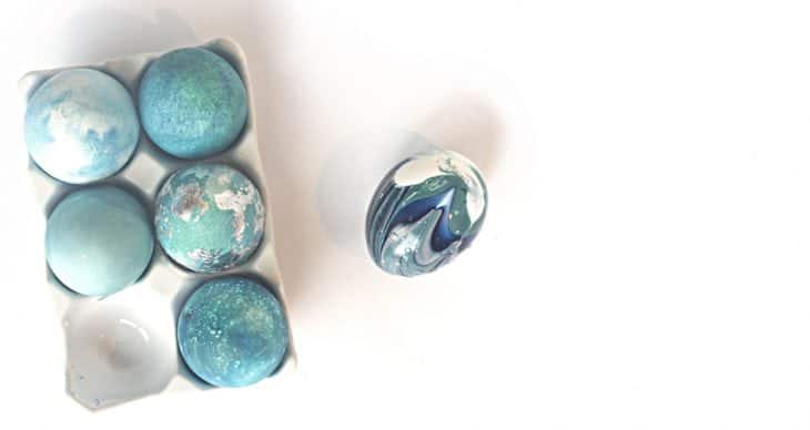 6 easter eggs decorated in shades of blue nail polish. 