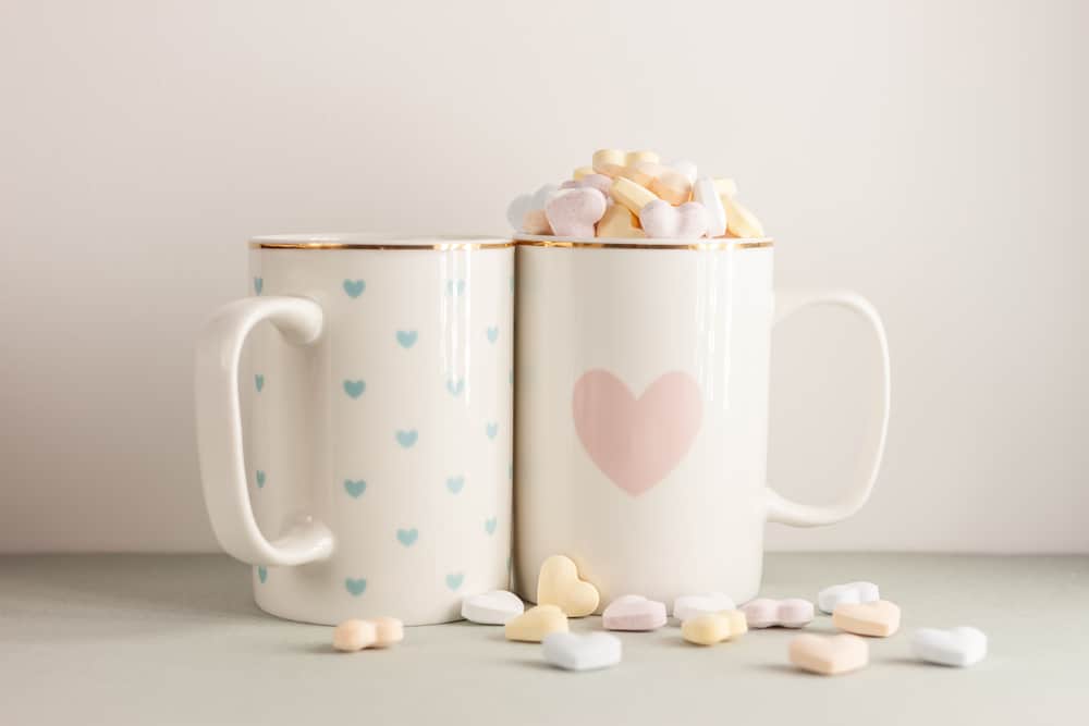 two white cups with lovely heart prints