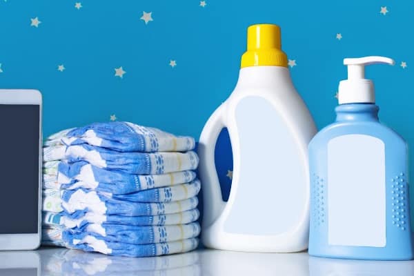disposable diapers beside laundry detergent - a consideration when having a baby on a budget