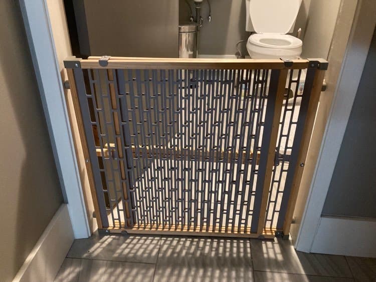 baby compression gate across a bathroom door