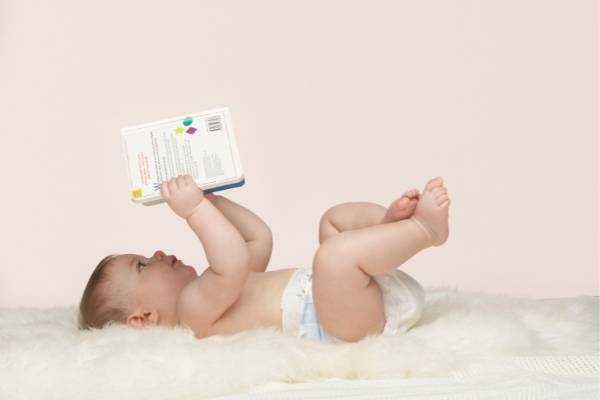 baby reading a book