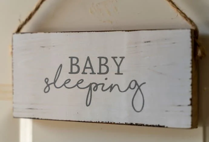 https://mommyonpurpose.com/wp-content/uploads/2022/07/sign-that-says-_sleeping-baby_.webp