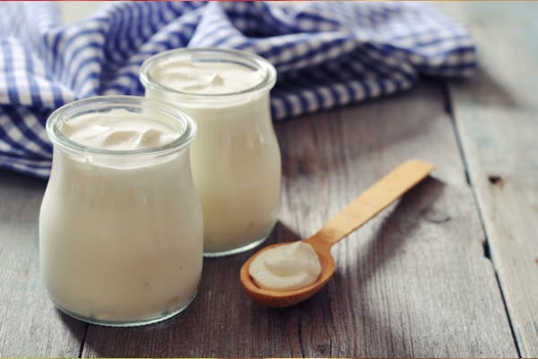 Greek yogurt tubs with spoon