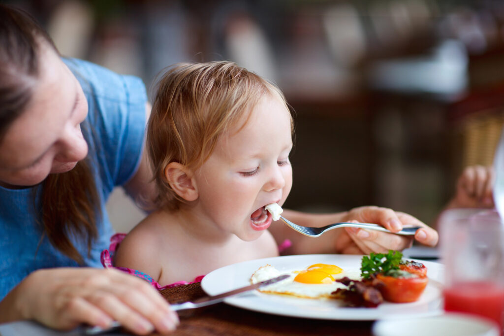 baby eating at dining table