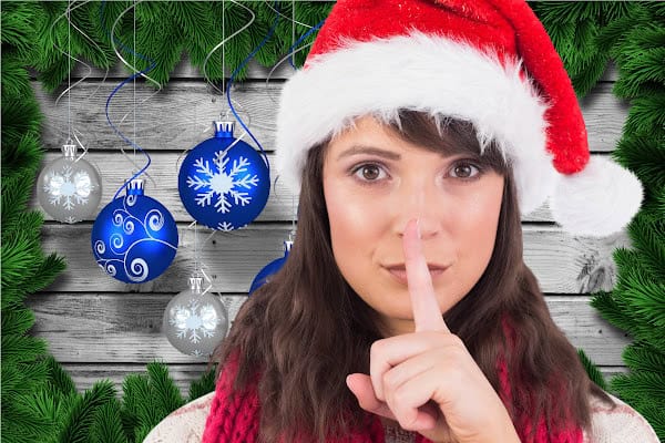 how to end santa woman shhh secret in a Christmas hat