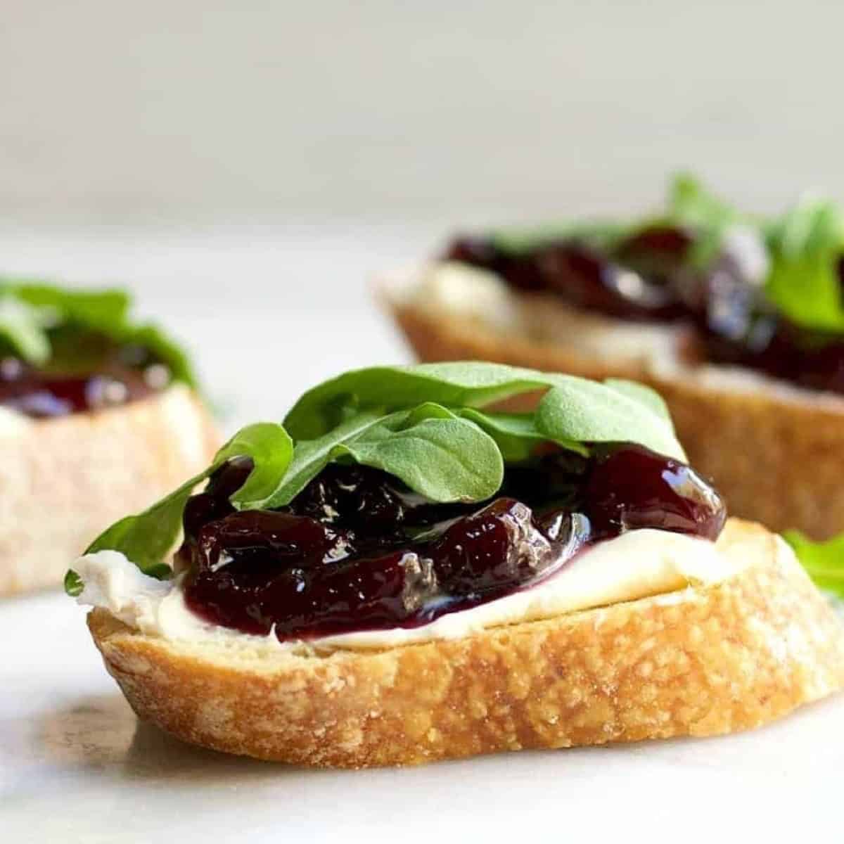 Brie Crostini With Cherries And Arugula