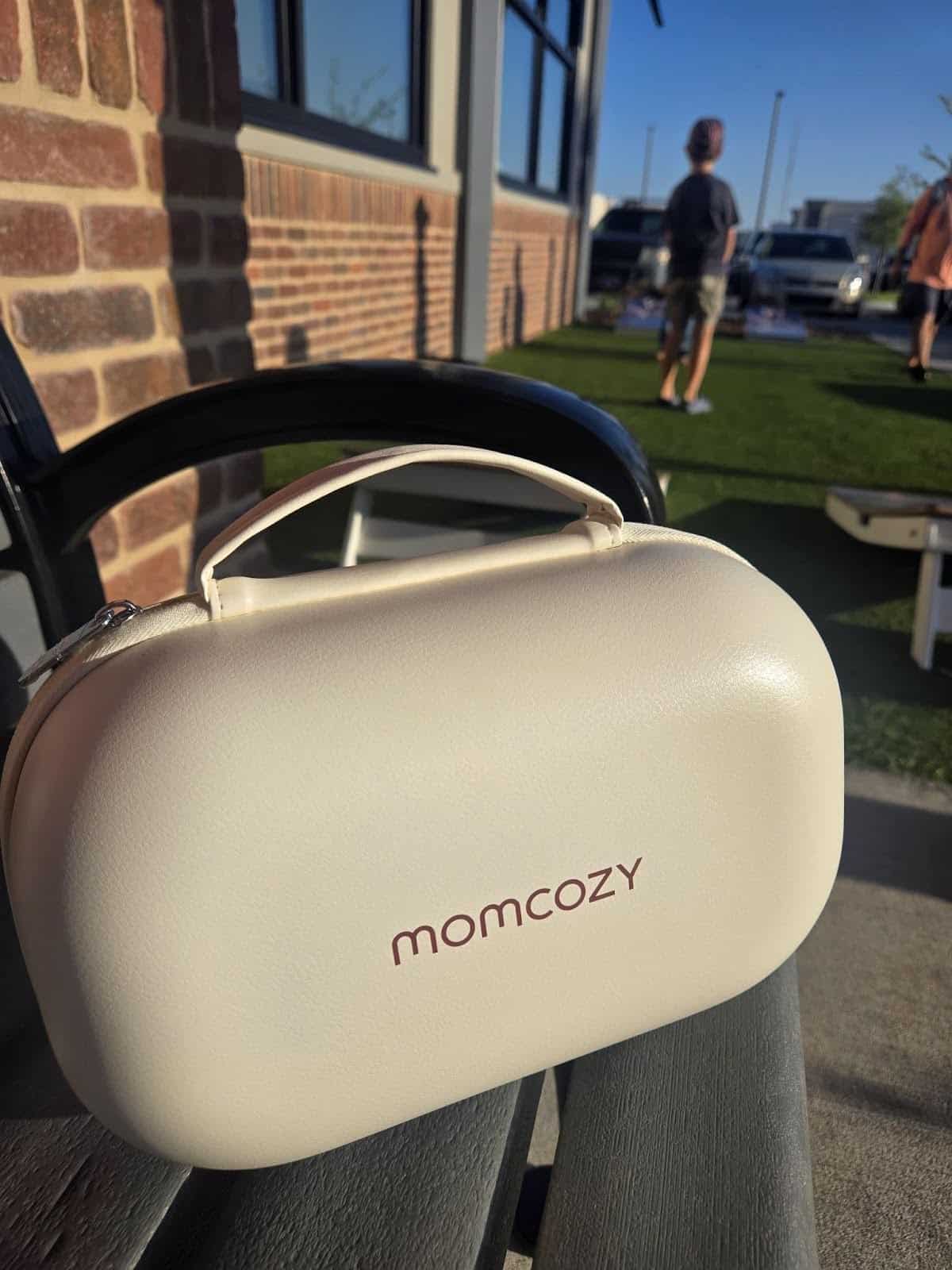 momcozy breast pump on a bench